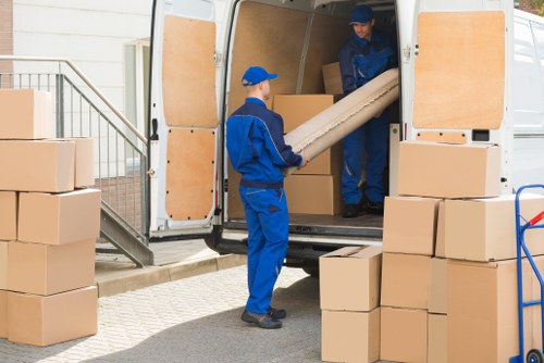 Removals team preparing a move in Surrey with boxes and furniture