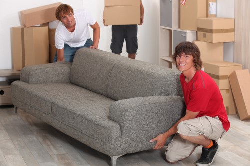 Removal service loading packed boxes from an apartment building in Surrey